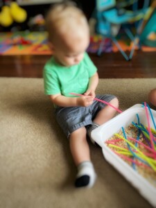 Toddler with sensory bin